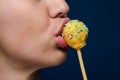 Girl with yellow cakepop